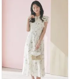 新品未使用tocco シアーストライプニュアンスフラワーラッフルフリル