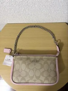 COACHアクセサリーポーチ　ハンドバッグ　ミニバッグ　ベージュ/ピンク