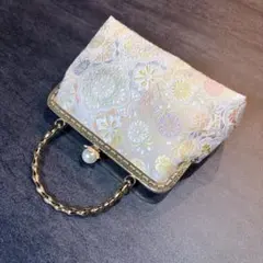 名門山口美術織物♡上品な淡いパステルカラー格の高い伝統柄上質な絹の煌めき帯バッグ 2026年最新】山口美術織物 帯の人気アイテム - メルカリ