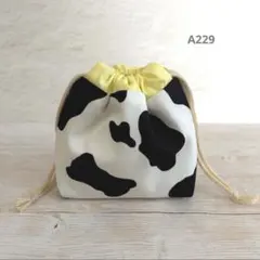 ハンドメイド＊おにぎり巾着袋＊保冷保温＊おにぎり1個用＊ホルスタイン柄＊イエロー