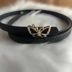黒の編み込みベルト 蝶のモチーフ