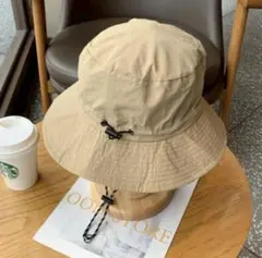 ベージュ　バケットハット 防水　UVカット　あご紐　折りたたみ　キャンプ　登山