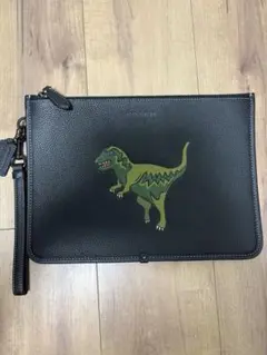 COACH 恐竜プリント クラッチバッグ