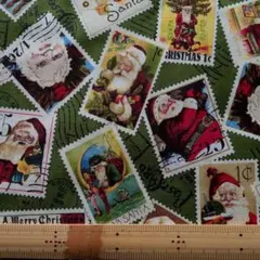 切手サンタ柄·深緑地　115cm Quilting Treasures