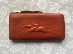 LONGCHAMP レザーラウンドジップ型押しロゴ　長財布　オレンジのサムネイル