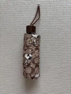 ⭐︎新品⭐︎COACH ✖️PEANUTSシグネーチャースヌーピー柄 折りたたみ傘 ⭐︎新品⭐︎COACH ✖️PEANUTSシグネーチャースヌーピー柄 折りたたみ