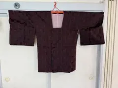 黒と赤のチェック柄 レインコート