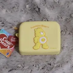 新品・未開封・匿名配送 ケアベア シリコンポーチ　イエロー