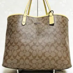 COACH コーチ リバーシブル トートバッグ ロゴチャーム付き イエロー黄色
