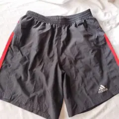 adidas ストライプショートパンツ 黒/オレンジ