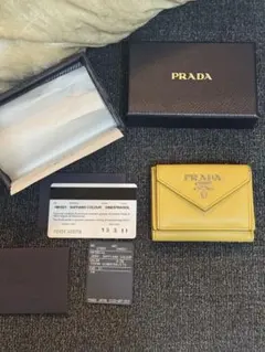 PRADA☆鑑定済☆GRACE TRIANG イエロー1MH044 プラダ財布 - メルカリ