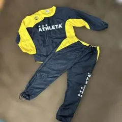 ATHLETA ピステ・ウィンドブレーカー 上下セット 黒/黄色　サイズ130
