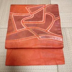 名古屋帯 オレンジ系 抽象模様