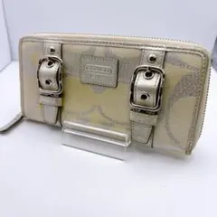 【COACH】長財布 ベージュ シグネチャー柄 ベルト金具 ラウンドファスナー