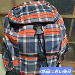 新品に近い美品LeSportsac リュックサック、黒、オレンジチェック柄