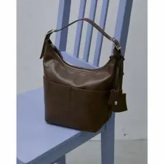 un/neu ワンハンドル２WAYラウンドバッグ