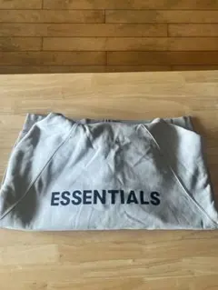 ESSENTIALS グレー ジップアップパーカー
