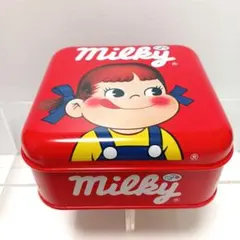 ペコちゃん缶ケース3種類と銀のNEWペコちゃん人形のサムネイル