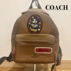 COACH ディズニーコラボ ビンテージレザーリュック バンダナチャーム付 