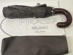 【極美品】PRADA 折りたたみ傘 レザーハンドル ブラウン　イタリア製 2026年最新】PRADA メンズ傘の人気アイテム - メルカリ