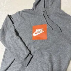 NIKE ナイキ　グレー フード付きパーカー オレンジロゴ　M