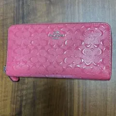 COACH ピンク 長財布 エンボス加工