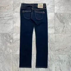 トミーヒルフィガーデニム　ストレッチ ジーンズ　デニム　濃紺　W25 L32古着のサムネイル