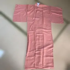 新品　着物　仕付糸あり　オレンジピンクみたいな色　柄あり