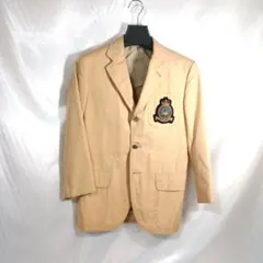 ベージュ エンブレム付き テーラードジャケット左脇下地破れアリ