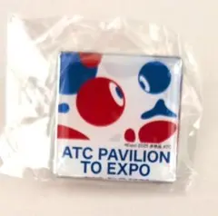 大阪関西万博ATC PAVILION ピンバッジ こみゃく ATCパビリオン - メルカリ