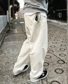 WACKOMARIA DOUBLE PLEATED CHINO TROUSERS