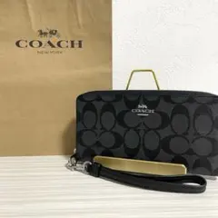 早い者勝ち！訳あり新品 COACH 長財布 シグネチャー柄 ストラップ付き
