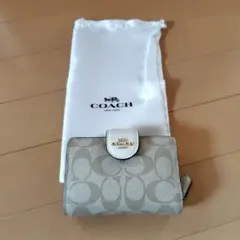 COACH 二つ折り財布 ベージュ 保存袋付き