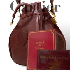 【良品】カルティエ　巾着ショルダーバッグ　マストライン　レザー　ロゴ金具斜め掛け