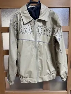 ベージュ 合成皮革 ジャケット プリントロゴ