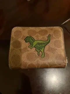 COACH 二つ折り財布 恐竜モチーフのサムネイル