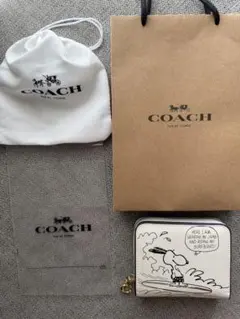 新品COACH コーチ　スヌーピー コラボ 二つ折り財布 サーフィンのサムネイル