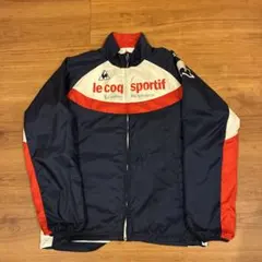 le coq sportif レディース ウィンドブレーカー ネイビー/レッド