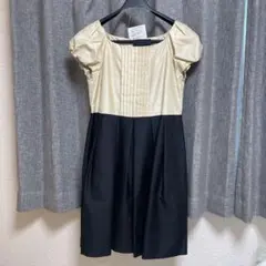 お呼ばれ結婚式などにゴールド・ブラック パフスリーブドレス