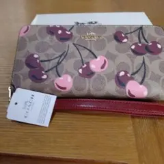 新品未使用タグ付きCOACH 長財布シグネチャージップアラウンドウォレット