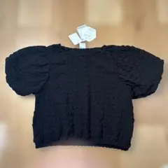 【新品】タグ付き 女の子 半袖トップス 黒 150 リボン柄 ぽこぽこ生地のサムネイル