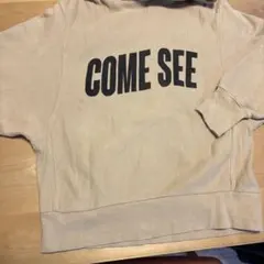 ロデオクラウンズ　ベージュ フード付きトレーナー COME SEE
