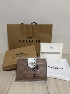 COACH 二つ折り財布 シグネチャー ブラウンのサムネイル