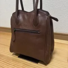 Dakota PRINCESS ハンドバッグ レザー ロゴ型押し 金具 自立