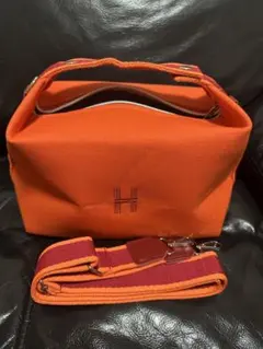 オレンジ キャンバス ポーチ Hロゴ ショルダーストラップ付き