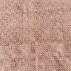 淡いピンクの立体模様生地