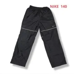 【美品】NIKE キッズ用トラックパンツ（ウインドブレーカーパンツ）140のサムネイル