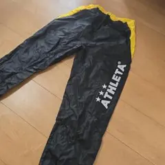 ATHLETA 黒/黄色 ロングパンツ160のサムネイル