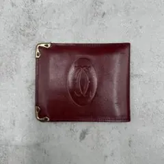 4405 美品 Cartier 二つ折り財布 ボルドー 型押しロゴ レザーのサムネイル