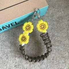 パラコード　ハンドスマホストラップ　☺︎ニコちゃん☺︎ お花　ハンドメイド